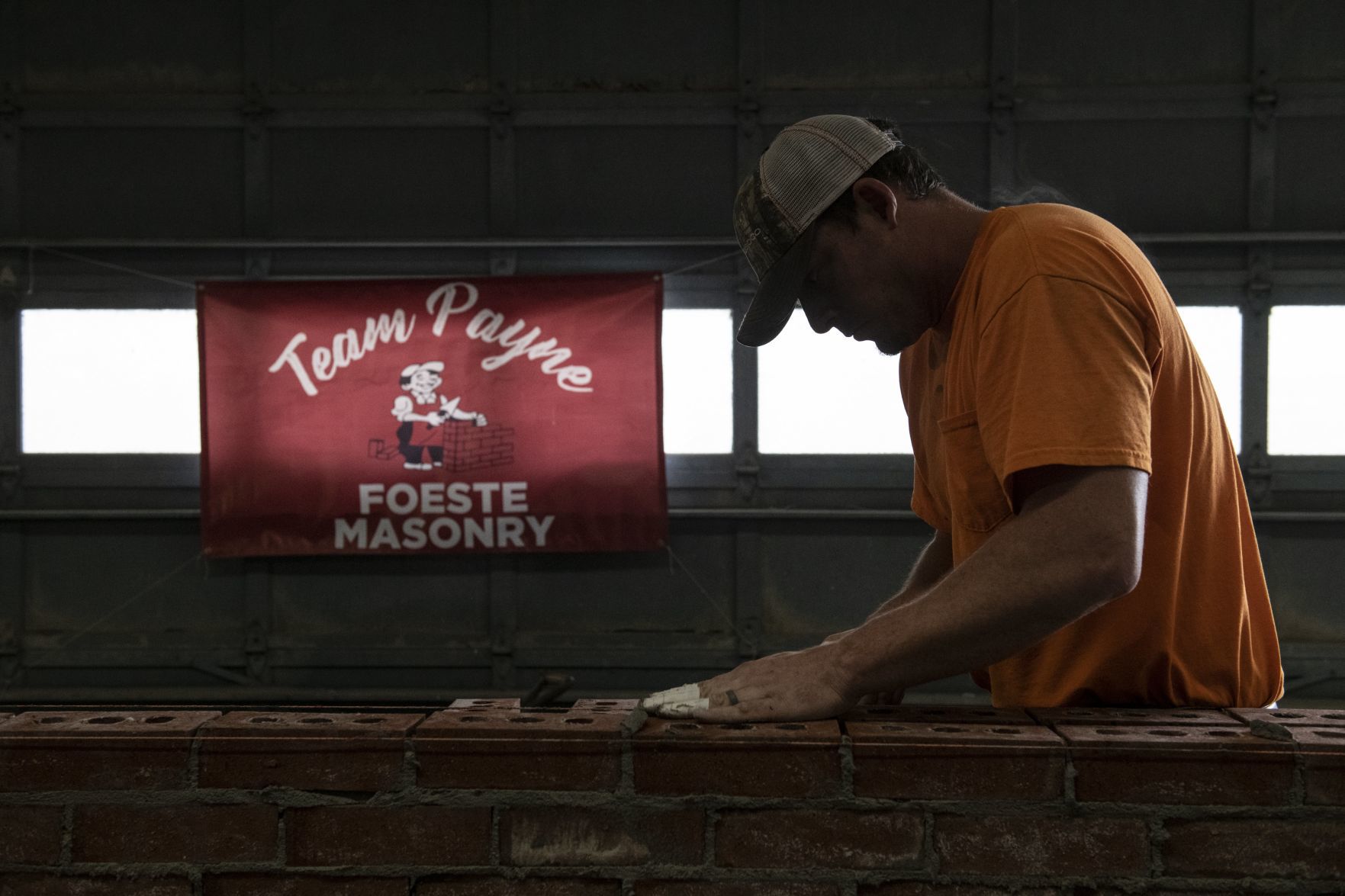 Payne lays bricks, hope for a victory in Bricklaying Contest